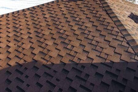 House with a roof from a bituminous tile. Bituminous tile for a roof. a roof from a bituminous tile.の写真素材