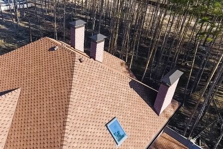 House with a roof from a bituminous tile. Bituminous tile for a roof. a roof from a bituminous tile.の写真素材