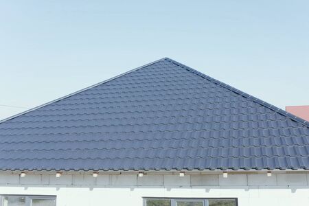 Modern roof made of metal. Corrugated metal roof and metal roofing.の写真素材
