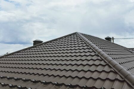 Modern roof made of metal. Corrugated metal roof and metal roofing.の写真素材