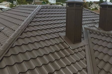 Modern roof made of metal. Corrugated metal roof and metal roofing.の写真素材