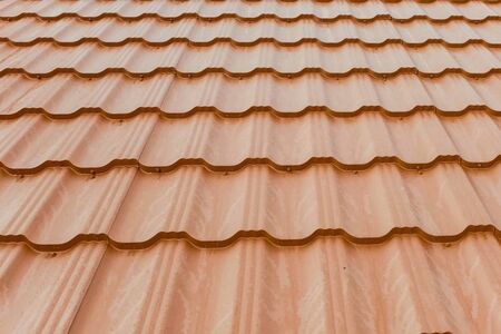 Modern roof made of metal. Corrugated metal roof and metal roofing.の写真素材