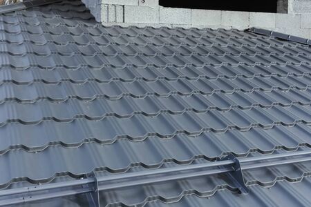 Modern roof made of metal. Corrugated metal roof and metal roofing.の写真素材