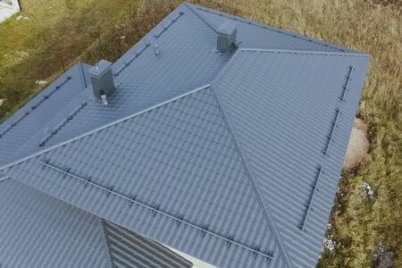 Modern roof made of metal. Corrugated metal roof and metal roofing.の写真素材