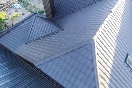 Modern roof made of metal. Corrugated metal roof and metal roofing.の写真素材
