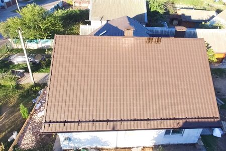 Modern roof made of metal. Corrugated metal roof and metal roofing.の写真素材