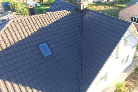 Modern roof made of metal. Corrugated metal roof and metal roofing.の写真素材