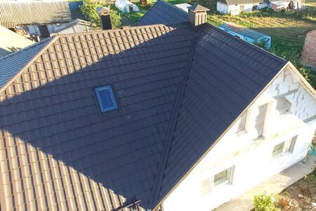 Modern roof made of metal. Corrugated metal roof and metal roofing.の写真素材