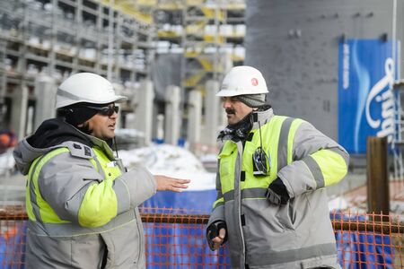 Tobolsk, Russia - June 14, 2018: Worker at the factory. Construction of a petrochemical and oil refinery near the city of Tobolsk in Russia, workers working on the installation and construction of the plant.の写真素材