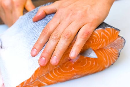 a Butchering salmon, piece of salmon red fish meat.の写真素材