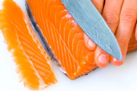 a Butchering salmon, piece of salmon red fish meat.の写真素材