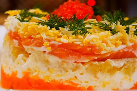 pie with red fish, boiled chicken eggs and red caviar.の写真素材