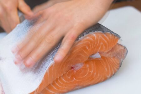 a Butchering salmon, piece of salmon red fish meat.の写真素材