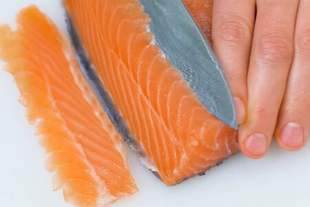 a Butchering salmon, piece of salmon red fish meat.の写真素材