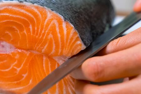 a Butchering salmon, piece of salmon red fish meat.の写真素材