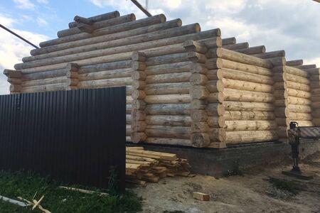 A large wooden house from a log house, details of a wooden structure under construction, a house from a log house.の写真素材