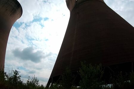 Old cooling towers of a closed nuclear power plant.の写真素材