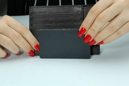 purse is a businesswoman in women's hands with makeup.の写真素材