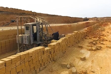 Shell quarry quarry. Cutting a seashell into blocks right away in a quarry.の写真素材