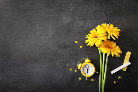 Teacher's day greeting card on black chalkboard background. Top view. Copy space.