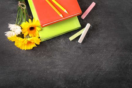 Teacher's day greeting card on black chalkboard background. Top view. Copy space.の写真素材