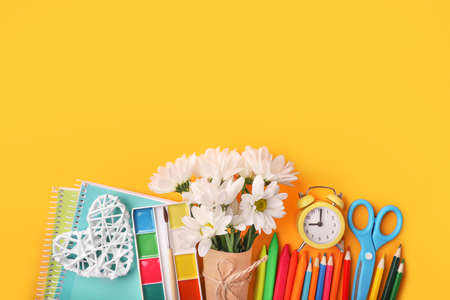 Teacher's day greeting card on orange background. Copy space.