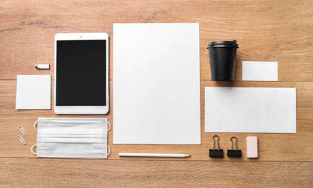 Corporate identity stationery set on wooden background. Top view.