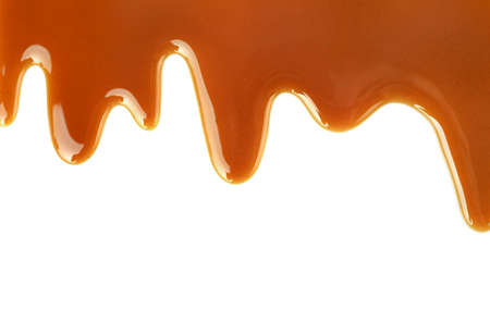 Sweet caramel topping isolated on white background. Top view. Copy space.の写真素材