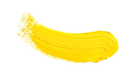 Yellow paint splatter isolated on white background.の写真素材