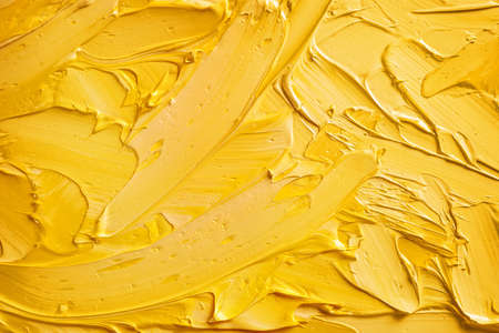 Yellow and beige paint abstract background.