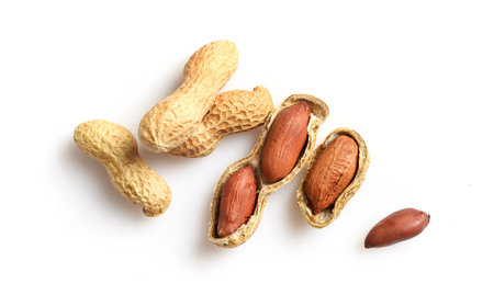 Peanuts in nutshell isolated on white background. Top view.
