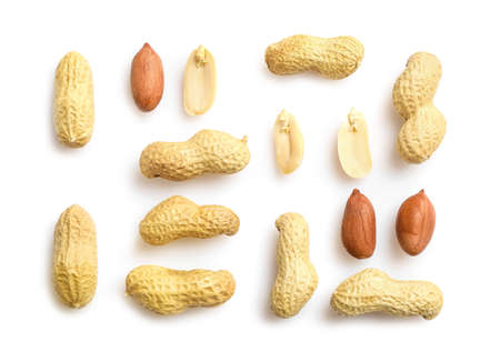 Flat lay of peanuts in nutshell, unpeeled and peeled peanuts isolated on white background. Top view.の写真素材
