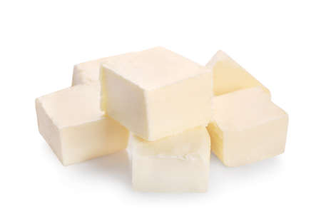 Pieces of fresh butter isolated on white background.