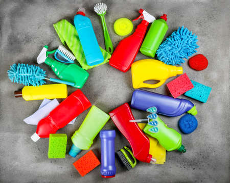 Cleaning products on stone gray background. Home cleaning concept. Top viewの写真素材