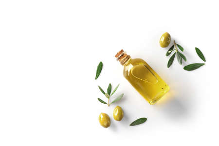 Olive branch and olive oil bottle isolated on white.の写真素材