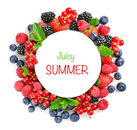 Circle frame of assorted wild fresh berries isolated on white background. top view.の写真素材