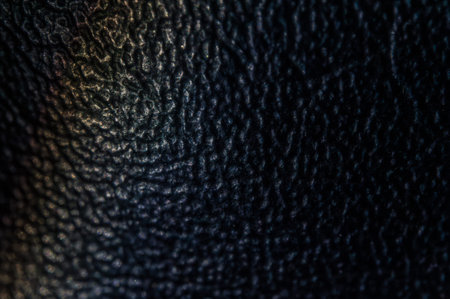 A deep ochre abstract texture background features a softly blurred gradient surface. Dense,...