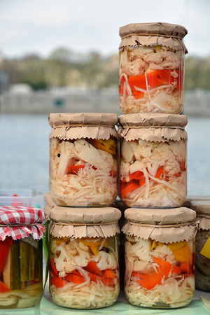 Preserved vegetables in glass jars.の写真素材