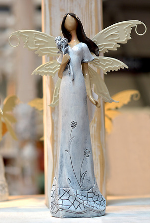 Angel with a flowerの写真素材