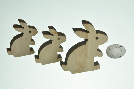 Christmas wooden bunnies and eggの写真素材