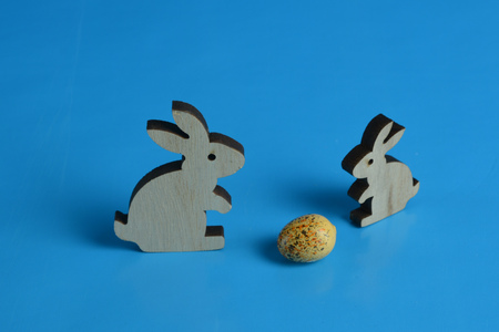 Christmas wooden bunnies and eggの写真素材