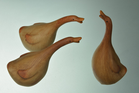 Wooden easter goose on glass backgroundの写真素材