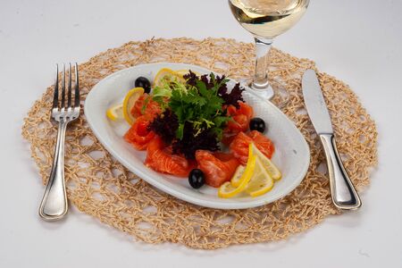 red fish with lettuce and lemonの写真素材