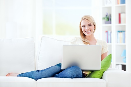 Beautiful young woman working at home.の写真素材
