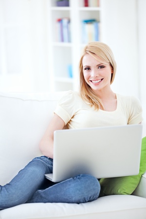 Beautiful young woman working at home.の写真素材