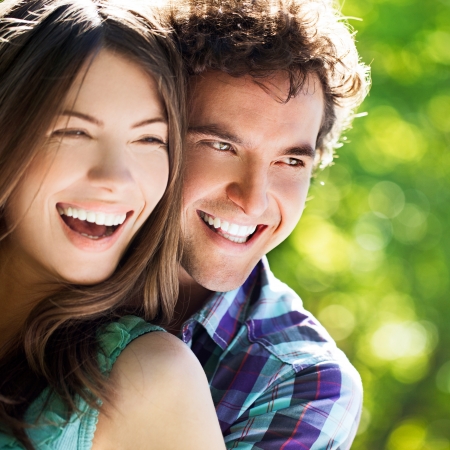 Young happy couple hugging and laughing.の写真素材