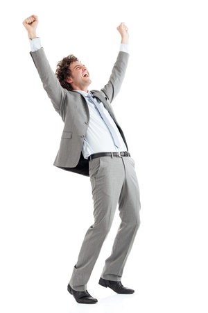 A young handsome businessman celebrating his business success.の写真素材