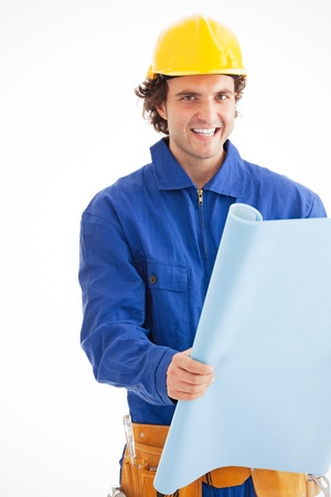 Portrait of a young construction worker smiling with blueprint  Isolated on white  Looking at camera の写真素材