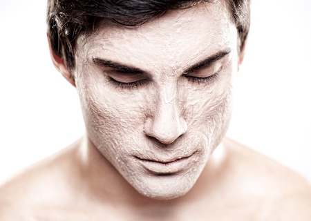 A handsome male model with a make-up foundation on his face.の写真素材