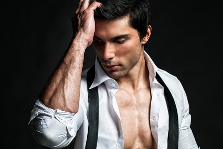 Handsome male model touching his head.の写真素材